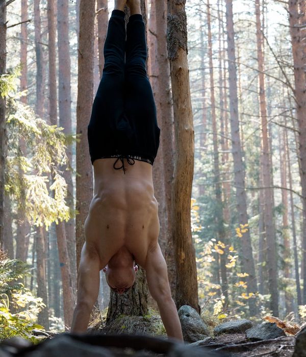 Man performing a bodyweight strength exercise with focus and control.